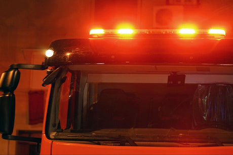 Picture of a fire truck at night with led fire truck lights flashing.