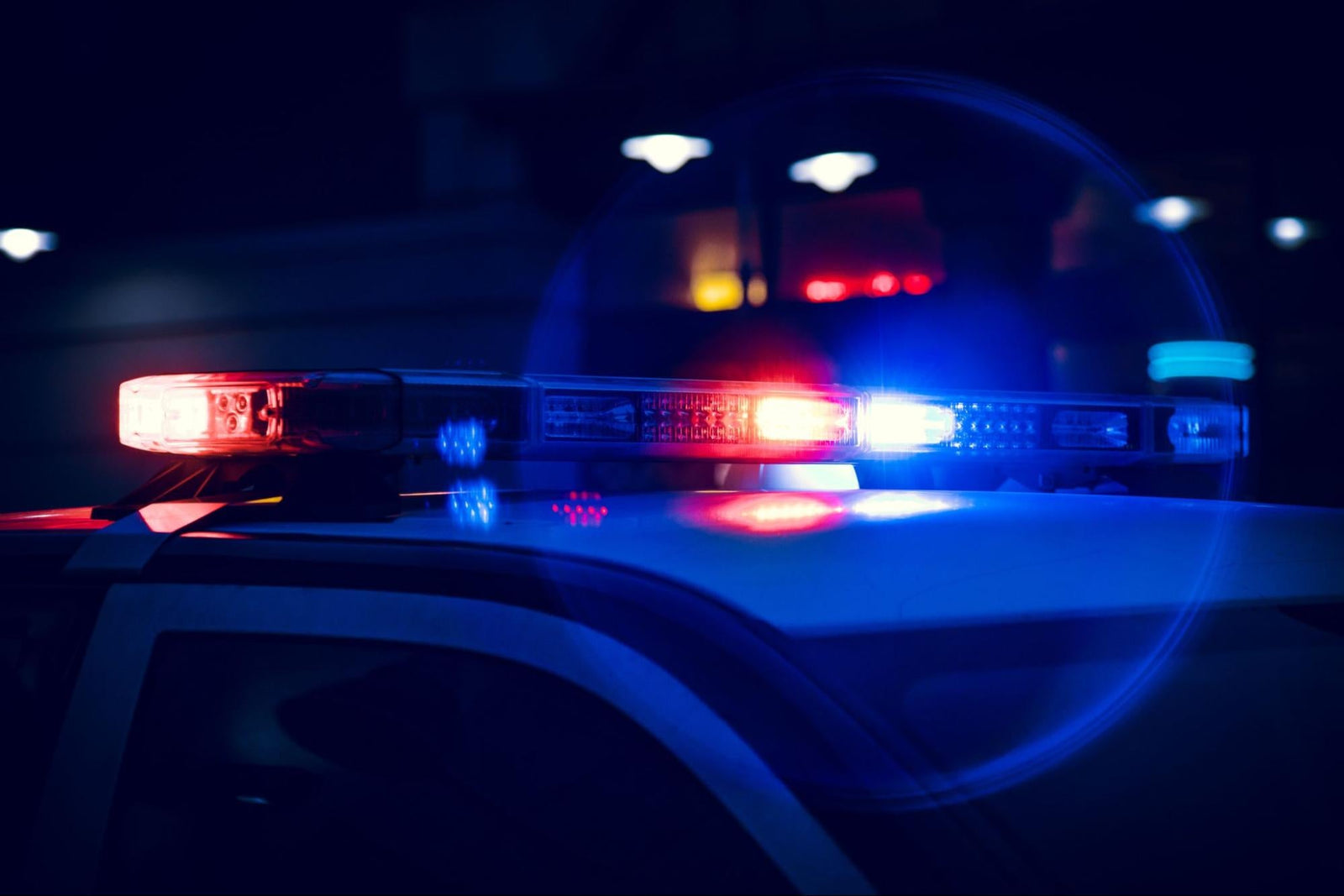 Red and blue emergency light bar on top of a police vehicle.